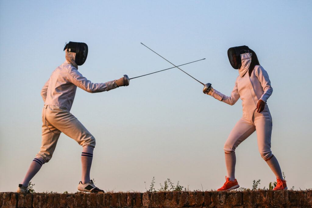 two people fencing sword fight battle 1201x800 5b2df79