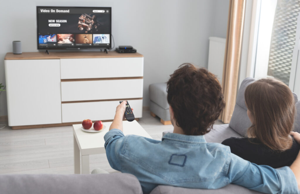 couple streaming tv living room