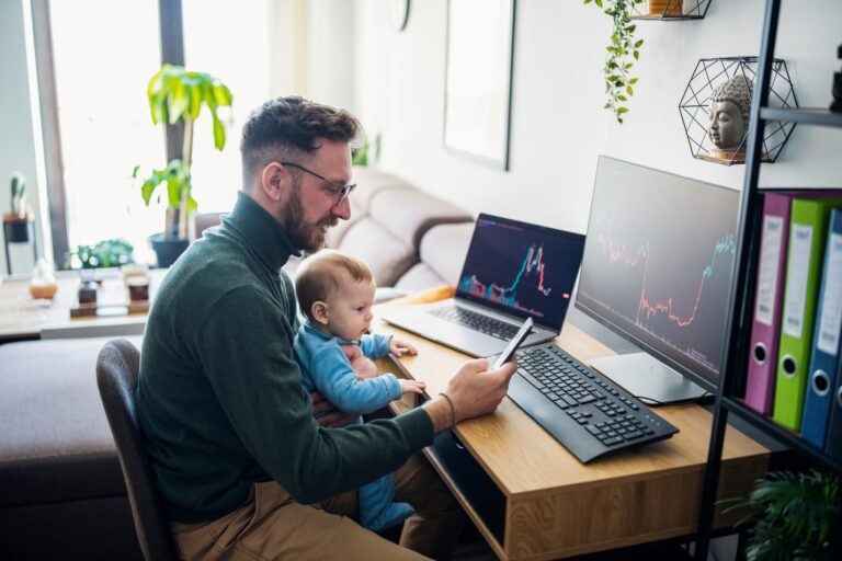 person looking at stock charts with a child